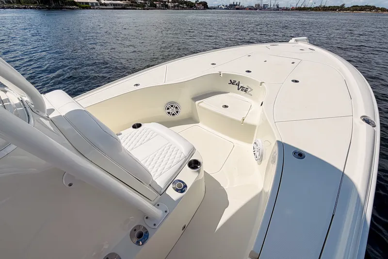 Slide: The Image of 2016 SeaVee 270Z boat interior with seating, on calm water. - 23