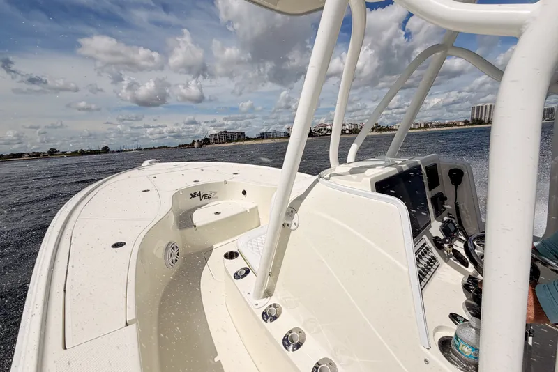 Slide: The Image of 2016 SeaVee 270Z boat navigating on water under a cloudy sky. - 20