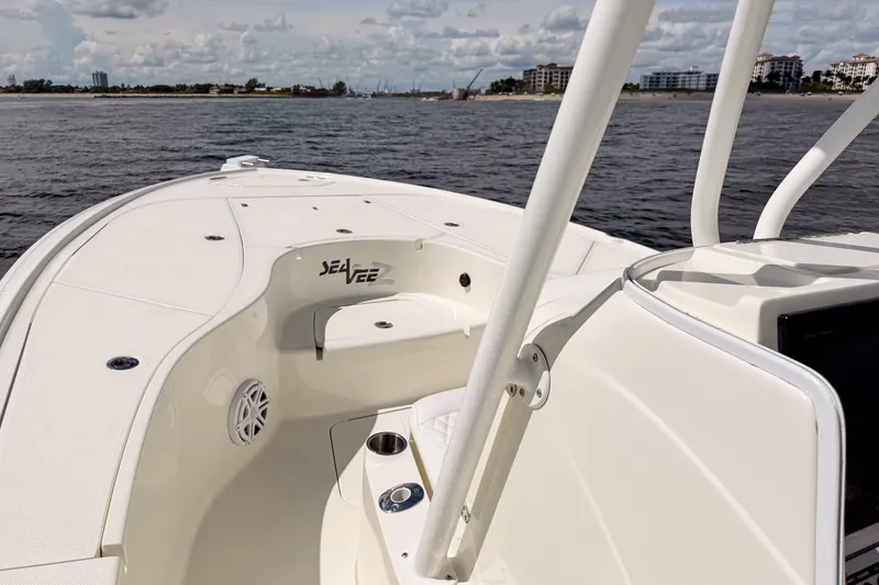 Slide: The Image of 2016 SeaVee 270Z boat on water, showcasing sleek design and spacious deck. - 18