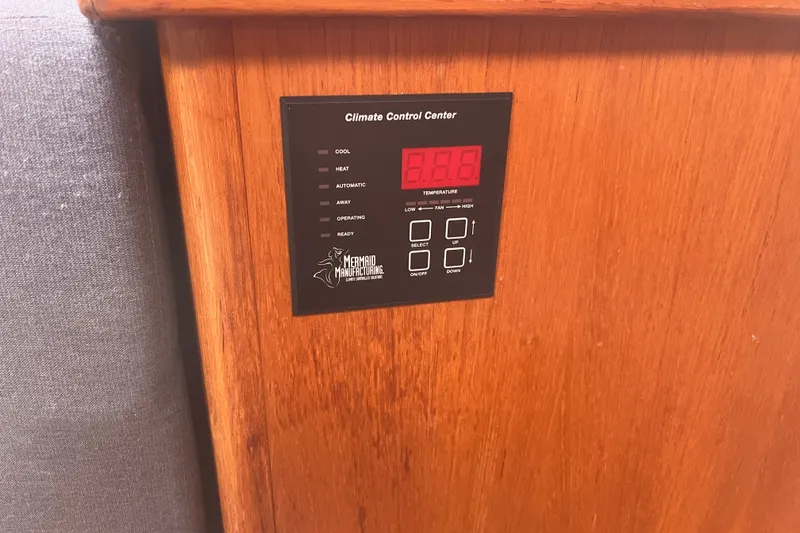 Slide: The Image of Climate control panel on a 2004 Hunter 36 boat, featuring temperature settings. - 15