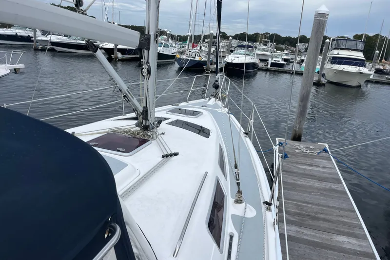 Slide: The Image of Sailboat docked at marina, Hunter 36 model, 2004, with surrounding boats. - 3