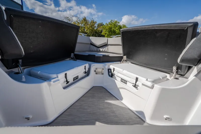 Slide: The Image of Interior view of 2027 Monterey Elite 27 OB boat with YETI coolers. - 44