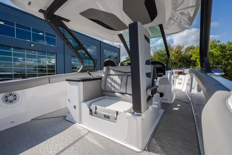 Slide: The Image of 2027 Monterey Elite 27 OB boat interior with modern seating and sleek design. - 21
