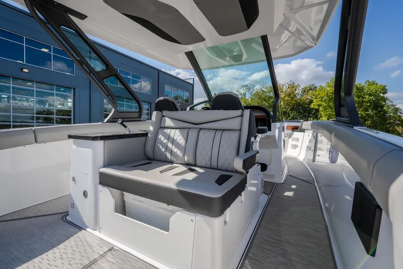 Slide: The Image of Luxurious interior of 2027 Monterey Elite 27 OB boat with modern seating and sleek design. - 20