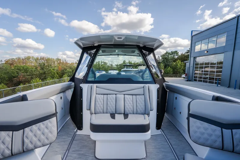 Slide: The Image of 2027 Monterey Elite 27 OB boat interior with luxurious seating and modern design. - 57
