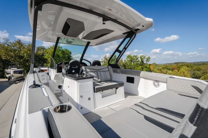 Slide: The Image of 2027 Monterey Elite 27 OB boat interior with sleek seating and modern design. - 17
