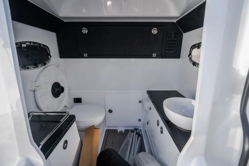 Slide: The Image of Interior of 2027 Monterey Elite 27 OB boat bathroom with modern fixtures and sleek design. - 49