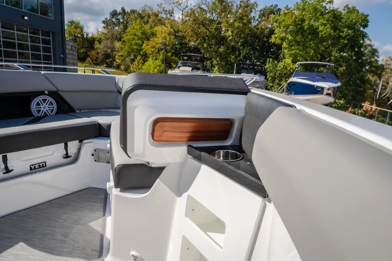 Slide: The Image of Interior of 2027 Monterey Elite 27 OB boat with seating and cup holder. - 41