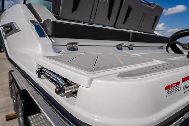 Slide: The Image of 2027 Monterey Elite 27 OB boat interior, featuring sleek seating and modern design elements. - 14