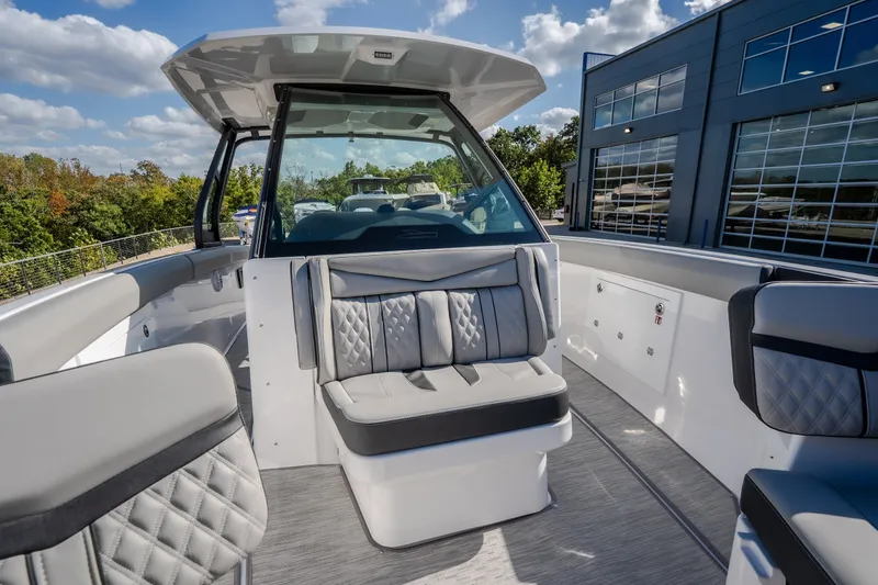 Slide: The Image of Luxurious 2027 Monterey Elite 27 OB boat interior with plush seating and modern design. - 47
