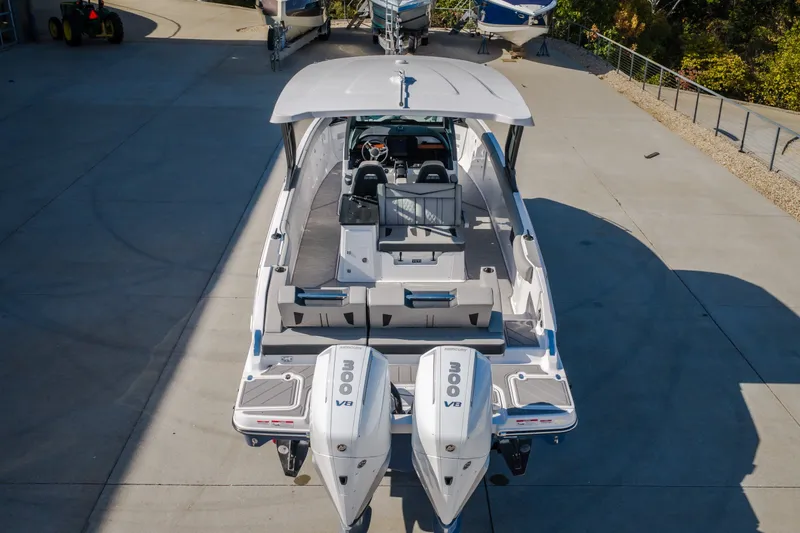 Slide: The Image of 2027 Monterey Elite 27 OB boat with dual 300 V8 engines, docked outdoors. - 68