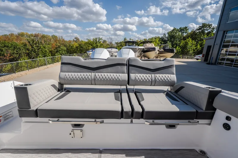 Slide: The Image of 2027 Monterey Elite 27 OB boat interior with luxurious gray seating and modern design. - 33