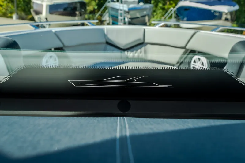 Slide: The Image of 2027 Monterey Elite 27 OB boat interior with sleek design and modern seating. - 28