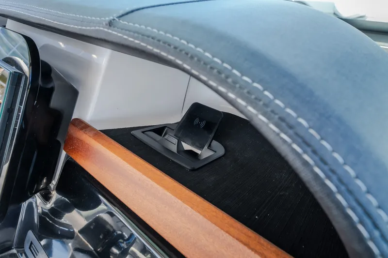 Slide: The Image of Dashboard of 2027 Monterey Elite 27 OB with wireless charging pad. - 54