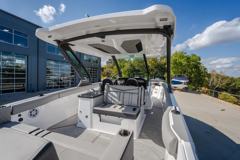 Slide: The Image of 2027 Monterey Elite 27 OB boat interior with sleek seating and modern design. - 15