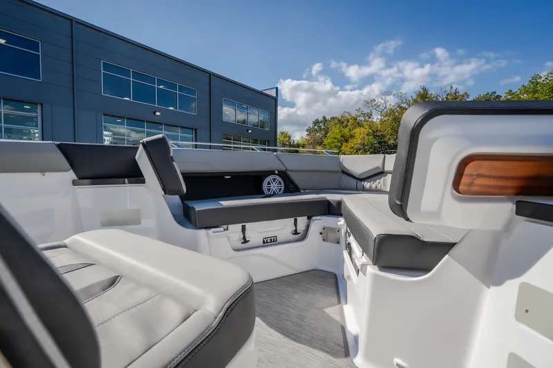 Slide: The Image of Interior view of 2027 Monterey Elite 27 OB boat with modern seating and sleek design. - 42