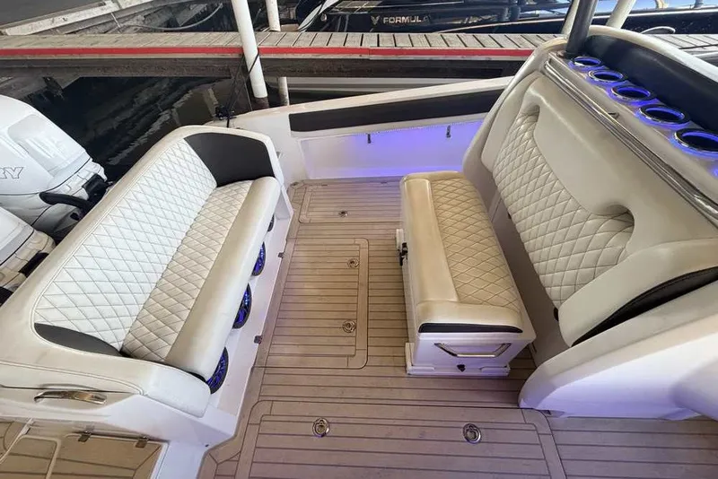 Slide: The Image of Luxurious interior of a 2014 Nor-Tech 340 Sport boat with quilted seating. - 6