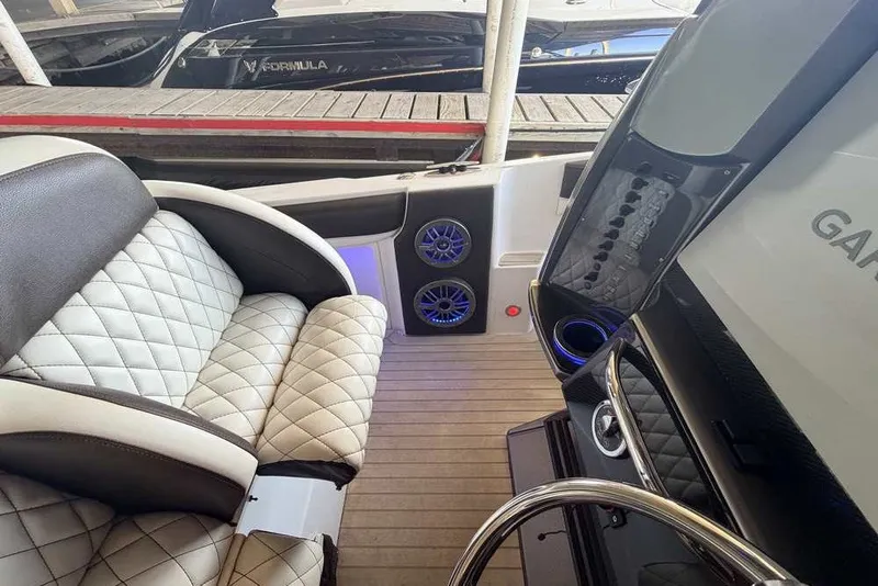 Slide: The Image of Luxurious interior of a 2014 Nor-Tech 340 Sport boat with quilted seating and modern audio system. - 13