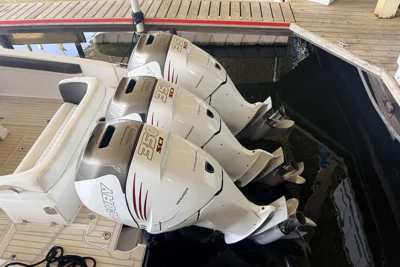 Slide: The Image of 2014 Nor-Tech 340 Sport boat with triple Mercury 350 Verado outboard engines. - 2