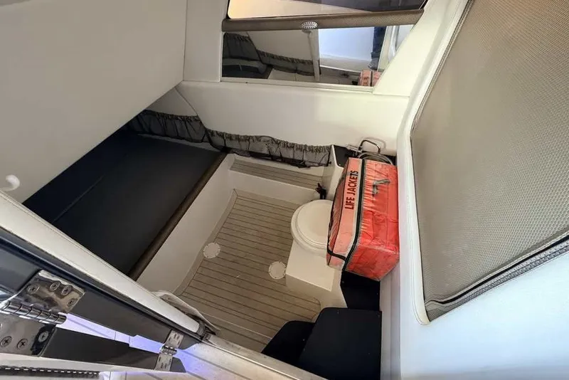 Slide: The Image of Interior cabin of 2014 Nor-Tech 340 Sport boat with life jackets and seating. - 29