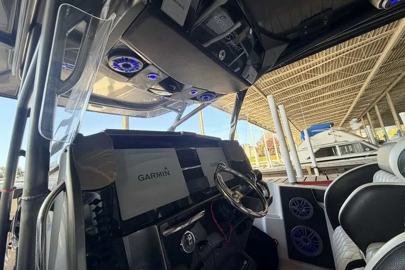 Slide: The Image of Interior view of 2014 Nor-Tech 340 Sport boat with Garmin navigation system. - 32