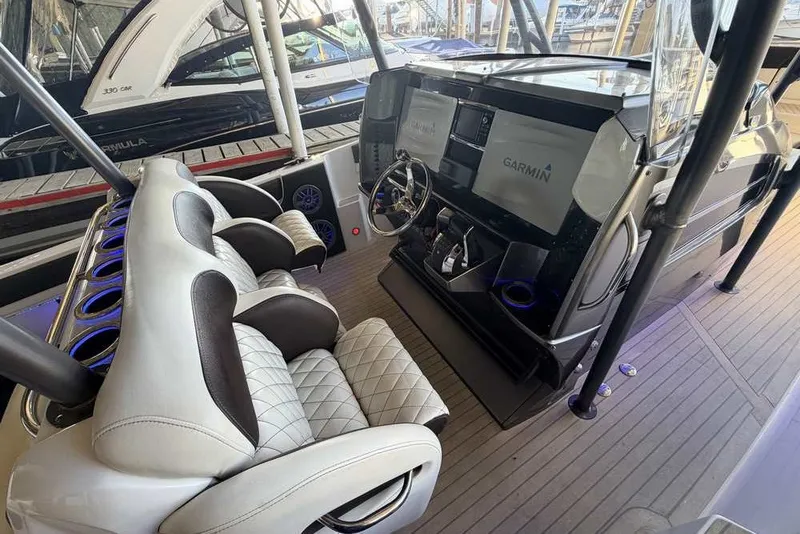 Slide: The Image of Interior of a 2014 Nor-Tech 340 Sport boat with Garmin navigation system. - 11