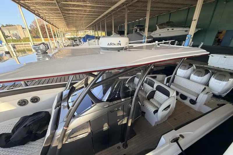 Slide: The Image of 2014 Nor-Tech 340 Sport boat with sleek seating and advanced navigation equipment. - 23