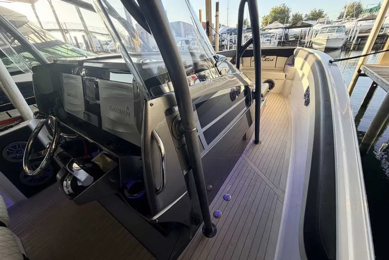 Slide: The Image of 2014 Nor-Tech 340 Sport boat interior with Garmin navigation system and sleek design. - 20