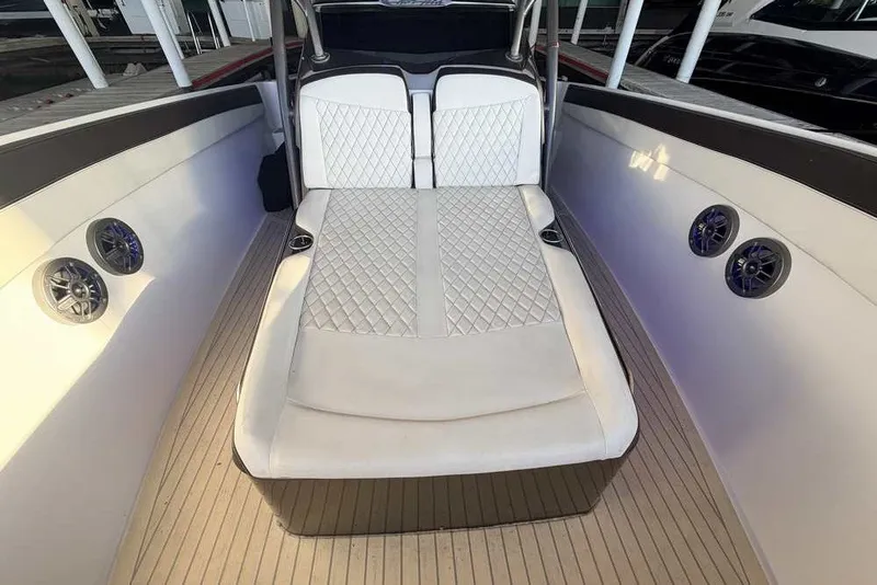 Slide: The Image of Luxurious interior of 2014 Nor-Tech 340 Sport boat with white quilted seating. - 28