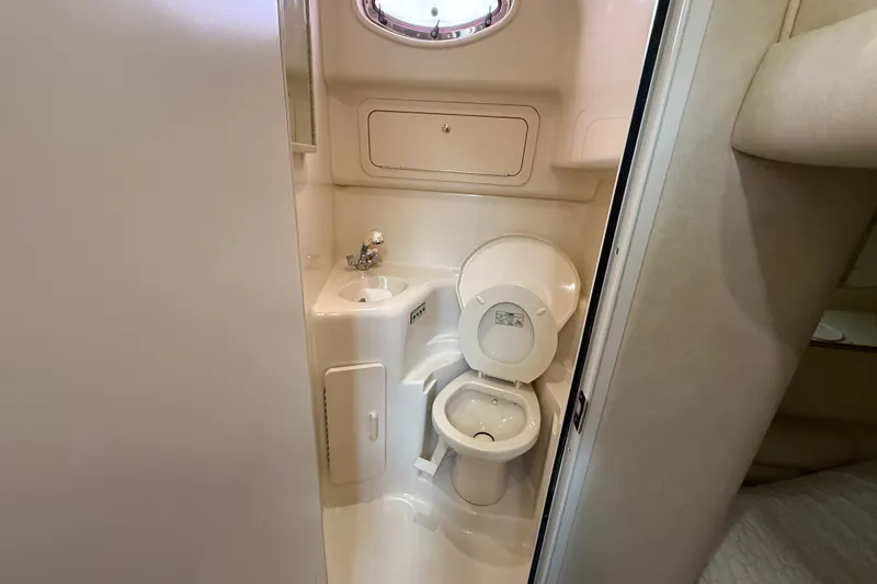 Slide: The Image of Bathroom interior of 1997 Sea Ray Sundancer 400 yacht, featuring toilet and sink. - 39
