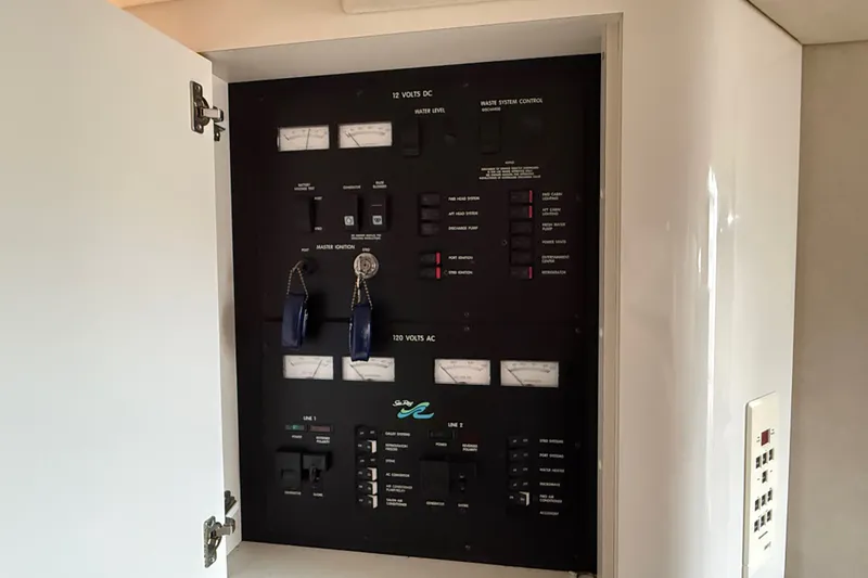 Slide: The Image of Electrical control panel inside a 1997 Sea Ray Sundancer 400 yacht. - 48
