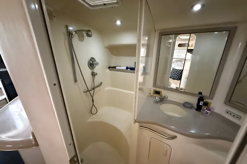 Slide: The Image of Bathroom interior of 1997 Sea Ray Sundancer 400 yacht, featuring shower and vanity. - 47