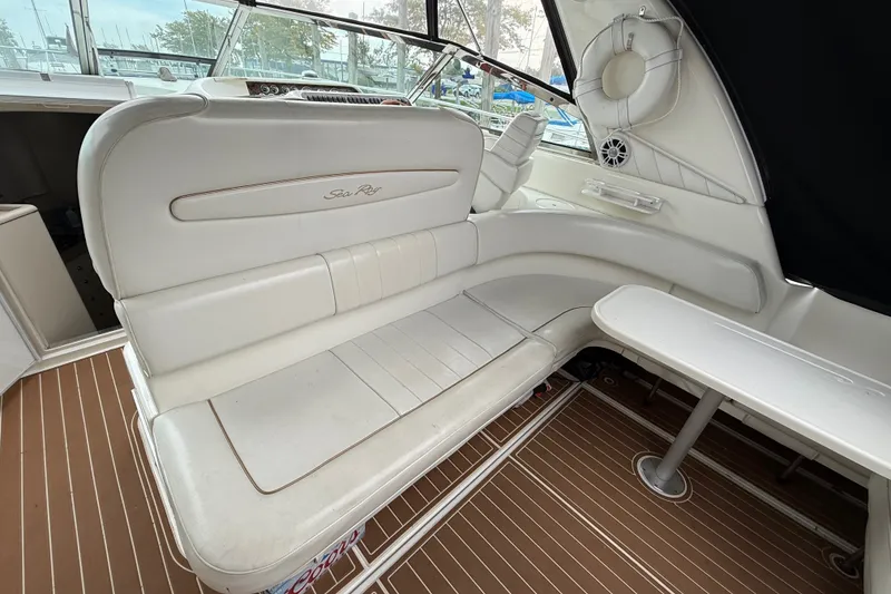Slide: The Image of Luxurious interior of 1997 Sea Ray Sundancer 400 yacht with white seating and table. - 16