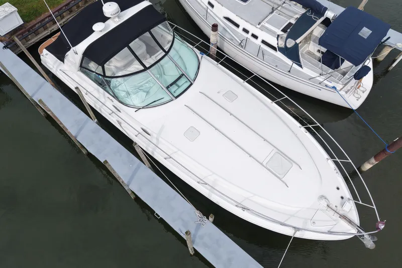 Slide: The Image of Aerial view of a 1997 Sea Ray Sundancer 400 docked at a marina. - 8