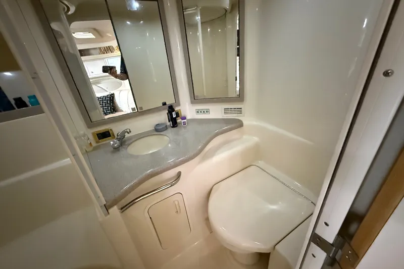 Slide: The Image of Bathroom interior of 1997 Sea Ray Sundancer 400 yacht, featuring sink and toilet. - 46