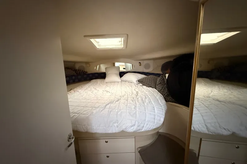 Slide: The Image of Cozy cabin interior of 1997 Sea Ray Sundancer 400 yacht with bed and skylight. - 43