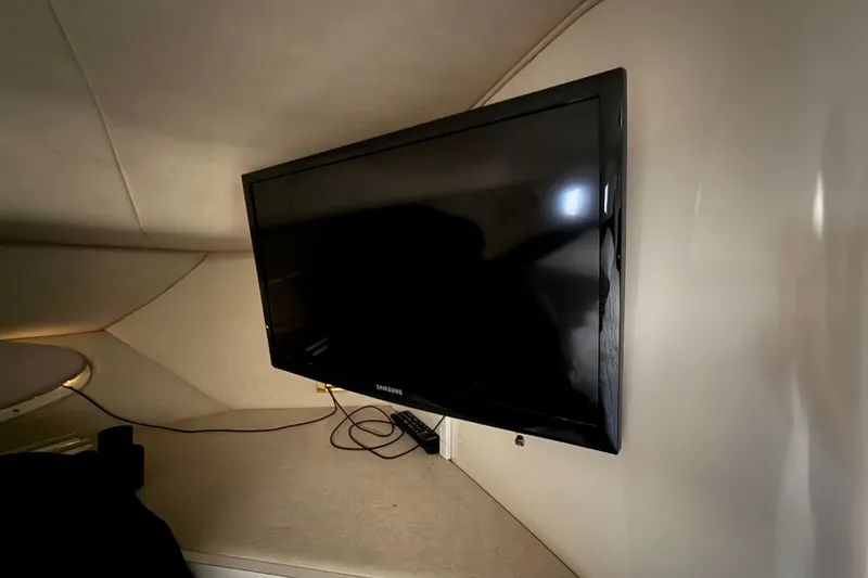Slide: The Image of Flat-screen TV mounted inside 1997 Sea Ray Sundancer 400 yacht cabin. - 45