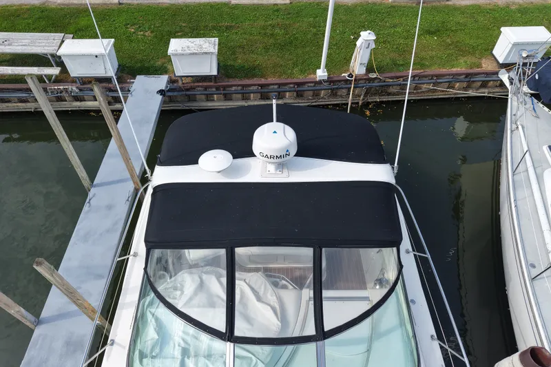 Slide: The Image of Overhead view of a 1997 Sea Ray Sundancer 400 docked at a marina. - 7