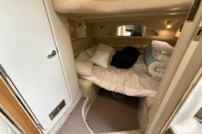 Slide: The Image of Cozy cabin interior of 1997 Sea Ray Sundancer 400 yacht with bed and soft lighting. - 38