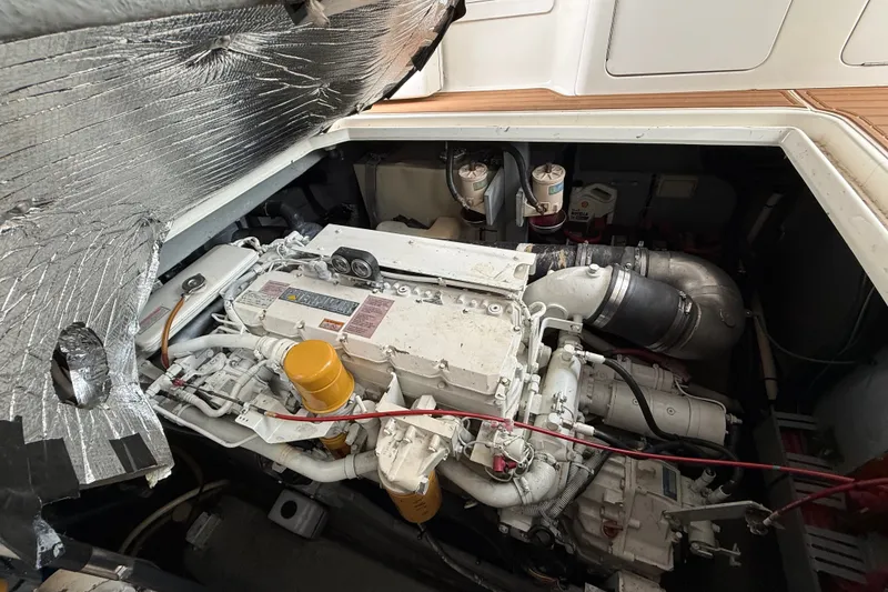 Slide: The Image of Engine compartment of a 1997 Sea Ray Sundancer 400, showcasing detailed mechanical components. - 29