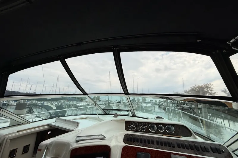 Slide: The Image of Interior view of 1997 Sea Ray Sundancer 400 yacht cockpit at marina. - 20