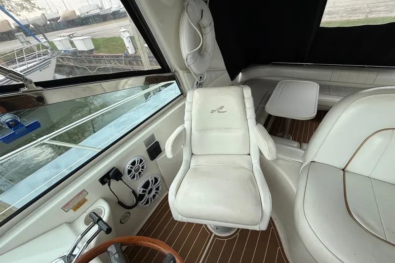 Slide: The Image of Interior of 1997 Sea Ray Sundancer 400 with white seating and wooden flooring. - 19