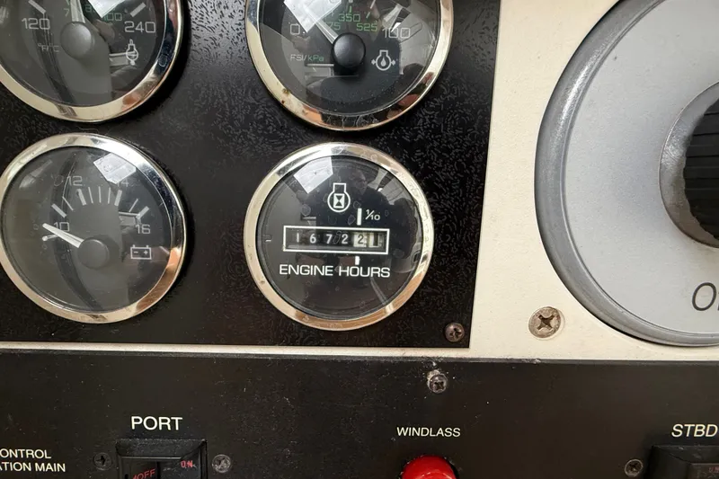 Slide: The Image of Close-up of 1997 Sea Ray Sundancer 400 engine hour meter showing 1672.1 hours. - 30