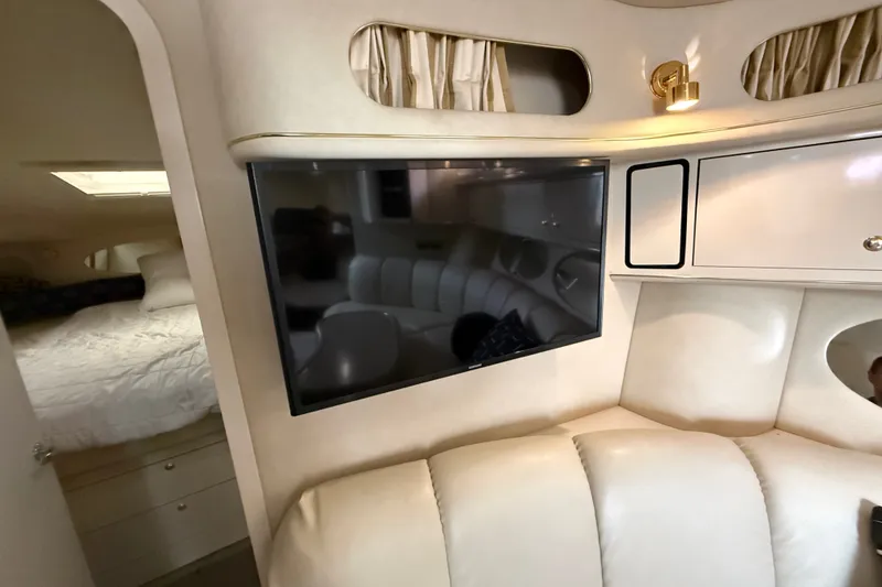 Slide: The Image of Interior of 1997 Sea Ray Sundancer 400 yacht with TV and cozy seating area. - 42