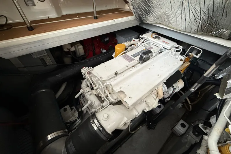Slide: The Image of Engine compartment of a 1997 Sea Ray Sundancer 400 yacht, showcasing detailed machinery. - 28