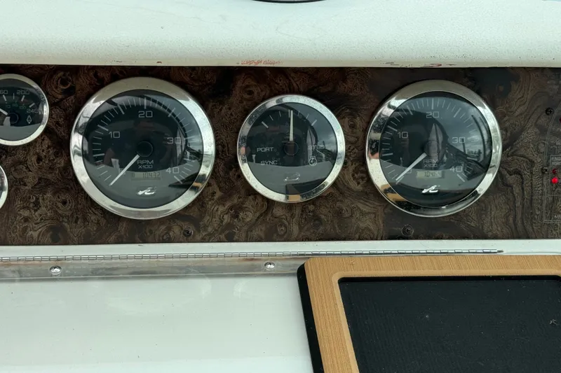 Slide: The Image of Dashboard gauges of a 1997 Sea Ray Sundancer 400 boat. - 23