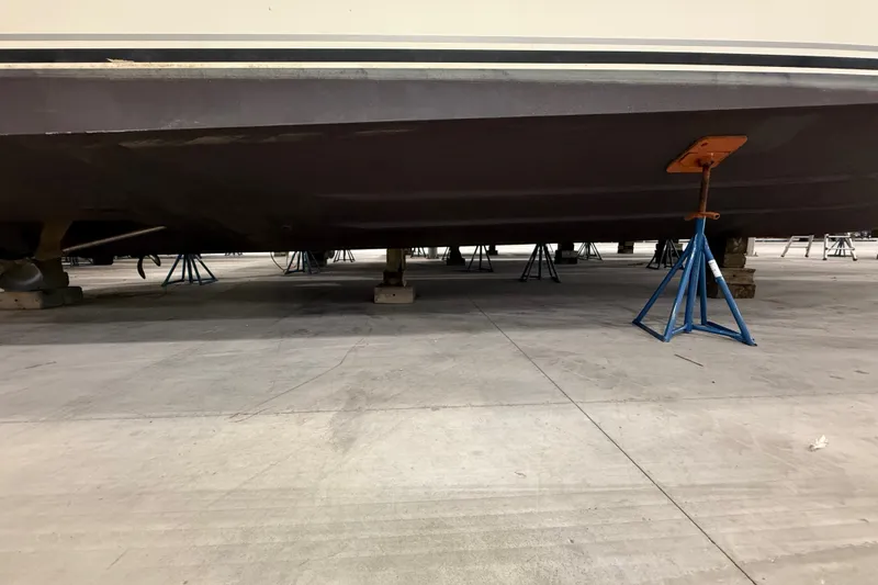Slide: The Image of 1997 Sea Ray Sundancer 400 yacht on stands in a storage facility. - 49