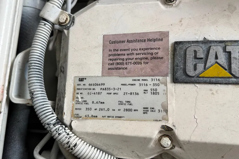 Slide: The Image of Engine label on a 1997 Sea Ray Sundancer 400, featuring CAT model 3116 specifications. - 27