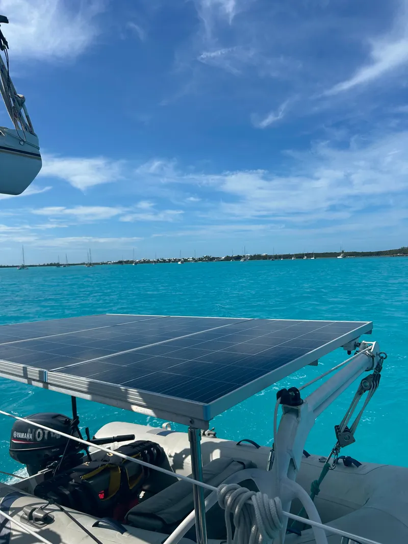 Slide: The Image of A solar panel on a catamaran in turquoise water. - 4