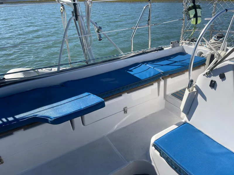 Slide: The Image of The image shows the cockpit of a 1990 Jeantot Privilege 39 with blue cushions. - 24